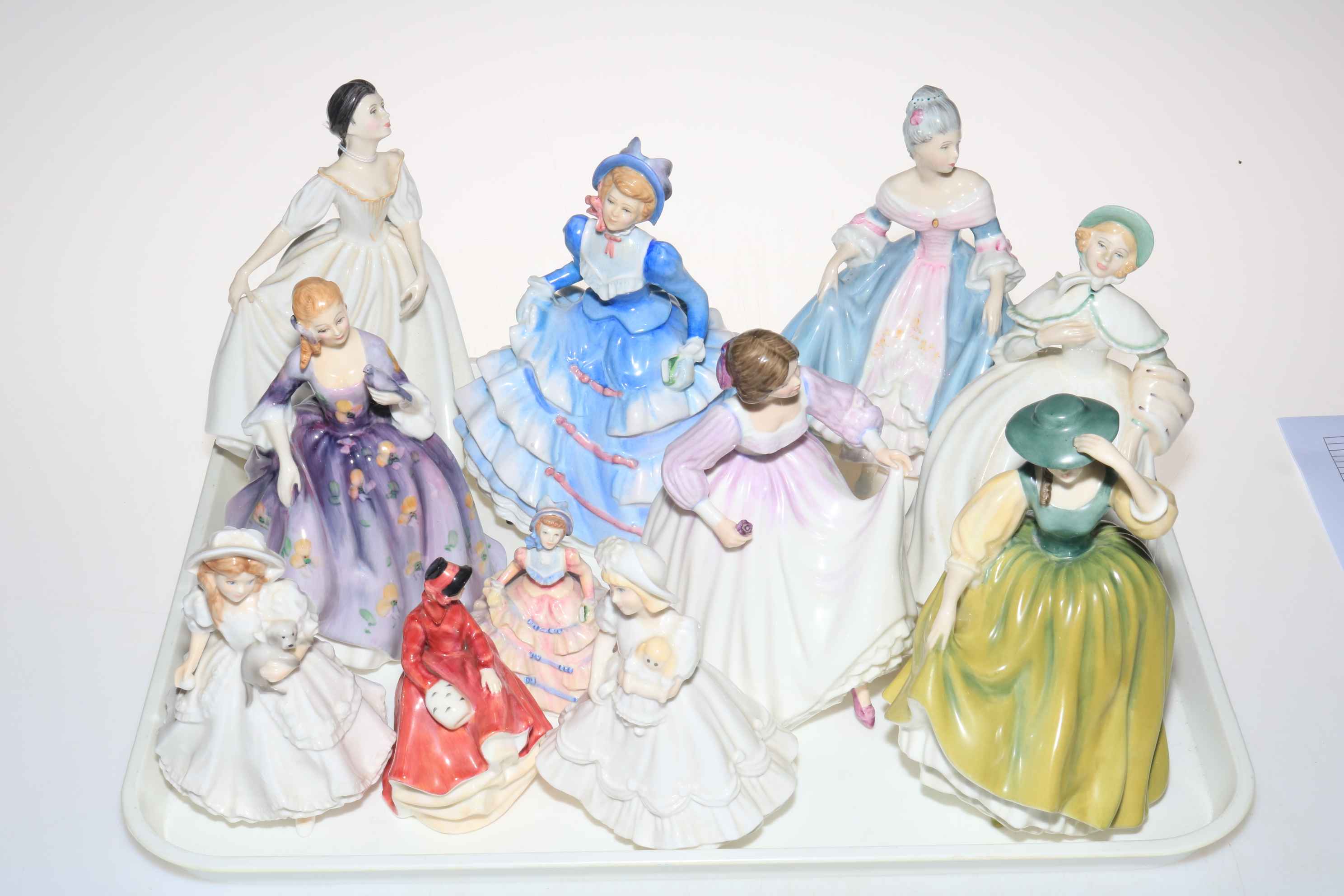 Ten Royal Doulton and one Royal Worcester figures (11).