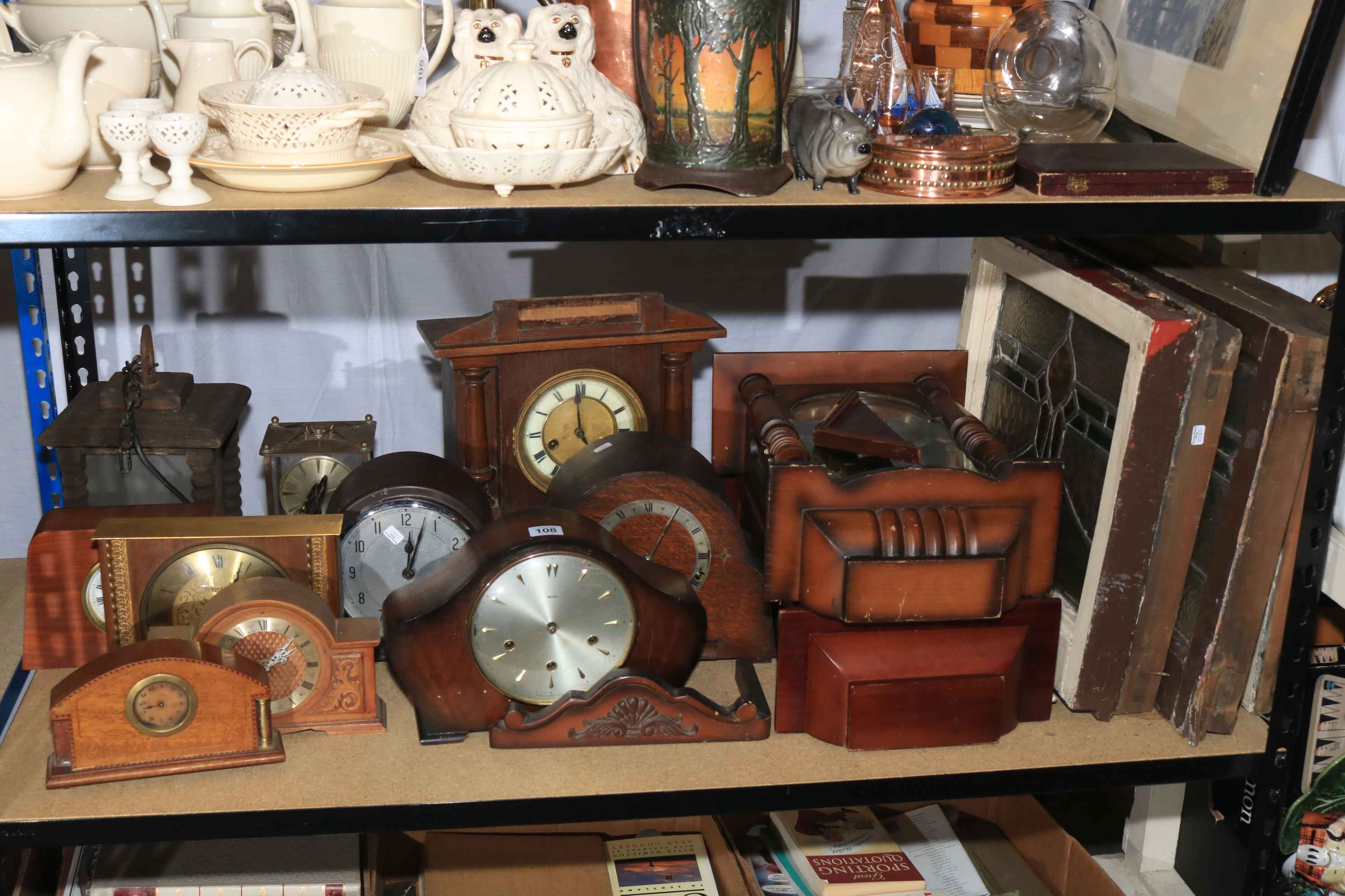 Collection of vintage mantel clocks and wall clocks together with stain glass windows and hanging