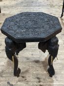 Heavily carved octagonal elephant table, 62cm by 62cm by 62cm.
