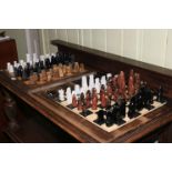 Two chess boards and chess pieces.