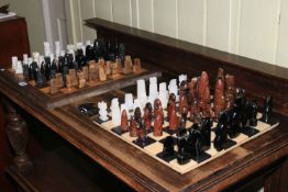 Two chess boards and chess pieces.