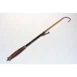 Victorian brass salmon gaff with turned wood handle.