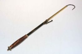 Victorian brass salmon gaff with turned wood handle.