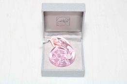 Lalique pink tinted glass pendant, boxed.