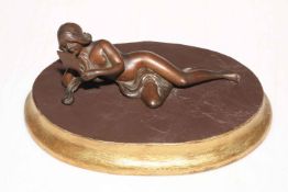 Art Nouveau style bronze reclining nude on wood plinth.