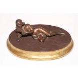 Art Nouveau style bronze reclining nude on wood plinth.