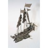 White metal model of a Chinese junk.
