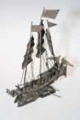 White metal model of a Chinese junk.