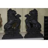 Pair of cast iron lion doorstops, 36cm high.