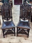 Pair Victorian carved oak and studded hide side chairs.
