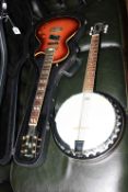 Electric guitar marked Gibson Epiphone and banjo marked Vintage.