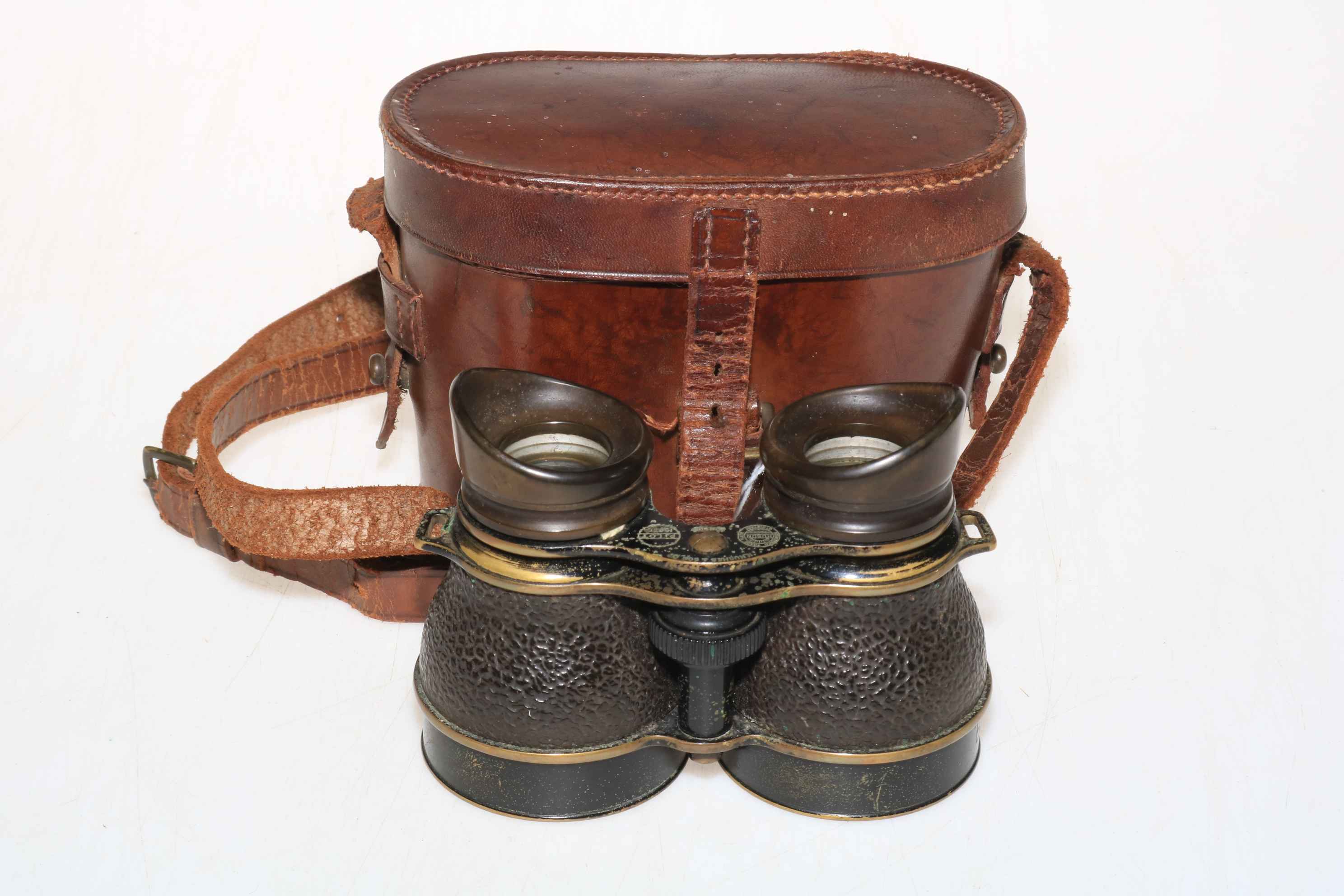 Pair vintage H. Hughes & Sons pilot binoculars in leather case.