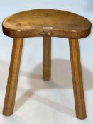 Robert Thompson of Kilburn 'Mouseman' three legged kidney shaped stool, 35cm by 30cm by 23cm.