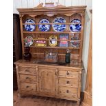 19th Century waxed pine dresser and Delft rack, 207.5cm by 147cm by 52cm.