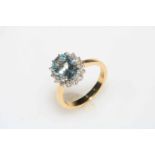 Diamond and aquamarine cluster ring set in 18 carat gold aquamarine total 2.