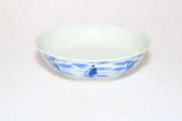 Blue and white Chinese shallow dish decorated with a series of figures, Kangxhi mark to base,