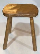 Robert Thompson 'Mouseman' four legged shaped top stool, 45cm by 37cm by 30cm.