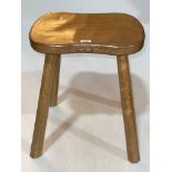 Robert Thompson 'Mouseman' four legged shaped top stool, 45cm by 37cm by 30cm.