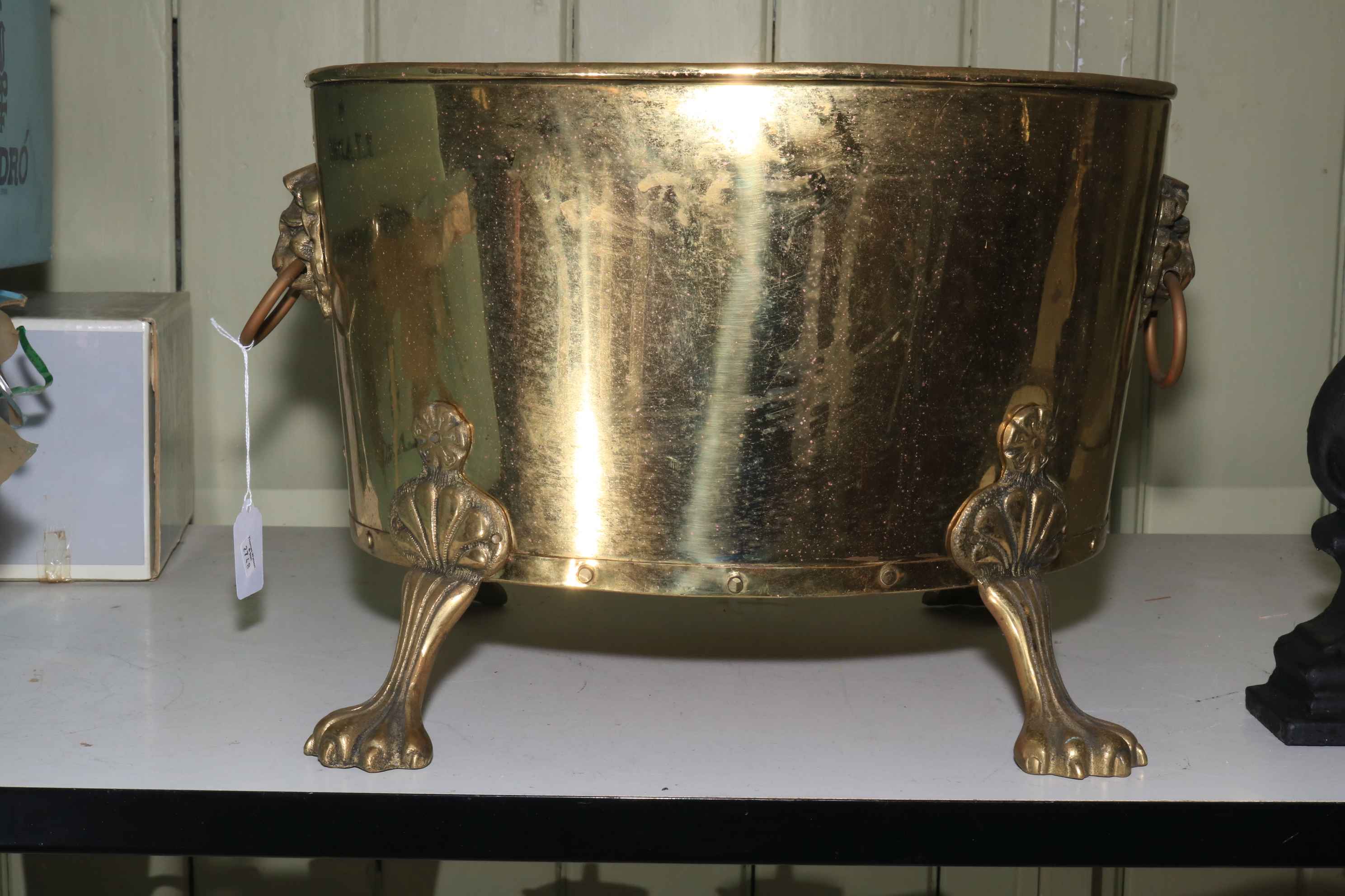 Brass claw feet coal bin, 30cm high.