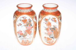 Pair of Japanese Kutani vases decorated with bird and floral design, 24cm high.