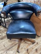 Early 20th Century black leather swivel office desk chair.