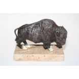 Metal cold painted model of an American Bison on a marble stand.