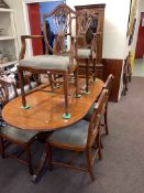 Mahogany nine piece dining suite comprising twin pedestal extending dining table and leaf,
