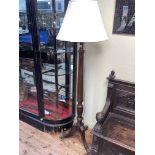 Mahogany reeded column tripod standard lamp and silk shade.