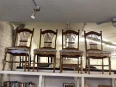 Set of four spindle back dining chairs.
