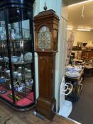 Antique oak and mahogany banded eight day longcase clock having arched dial signed Nich Muddle,