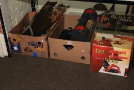 Collection of tools including saws, Power Devil pack, table saw, mallet, etc.