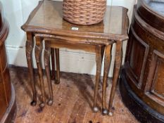 Walnut nest of three cabriole leg tables (largest 55cm by 55cm by 42cm).