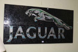 Glass mosaic on panel of Jaguar Trademark, 61cm by 123cm.