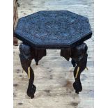 Heavily carved octagonal elephant table, 62cm by 62cm by 62cm.