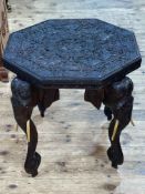 Heavily carved octagonal elephant table, 62cm by 62cm by 62cm.