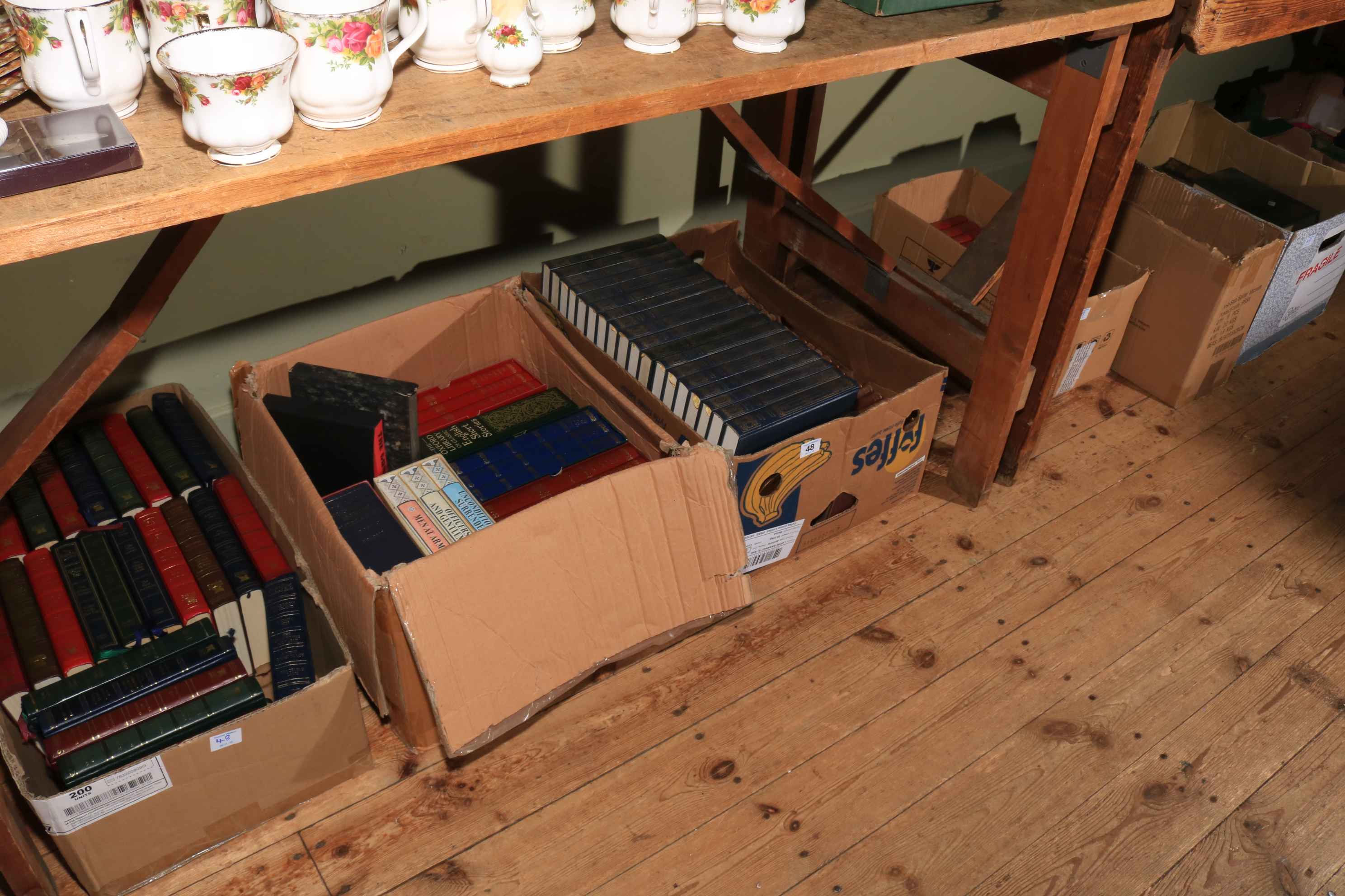 Six boxes of books including novels.