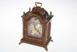 Warmink walnut brass mounted bracket style mantel clock with brass and silvered dial.
