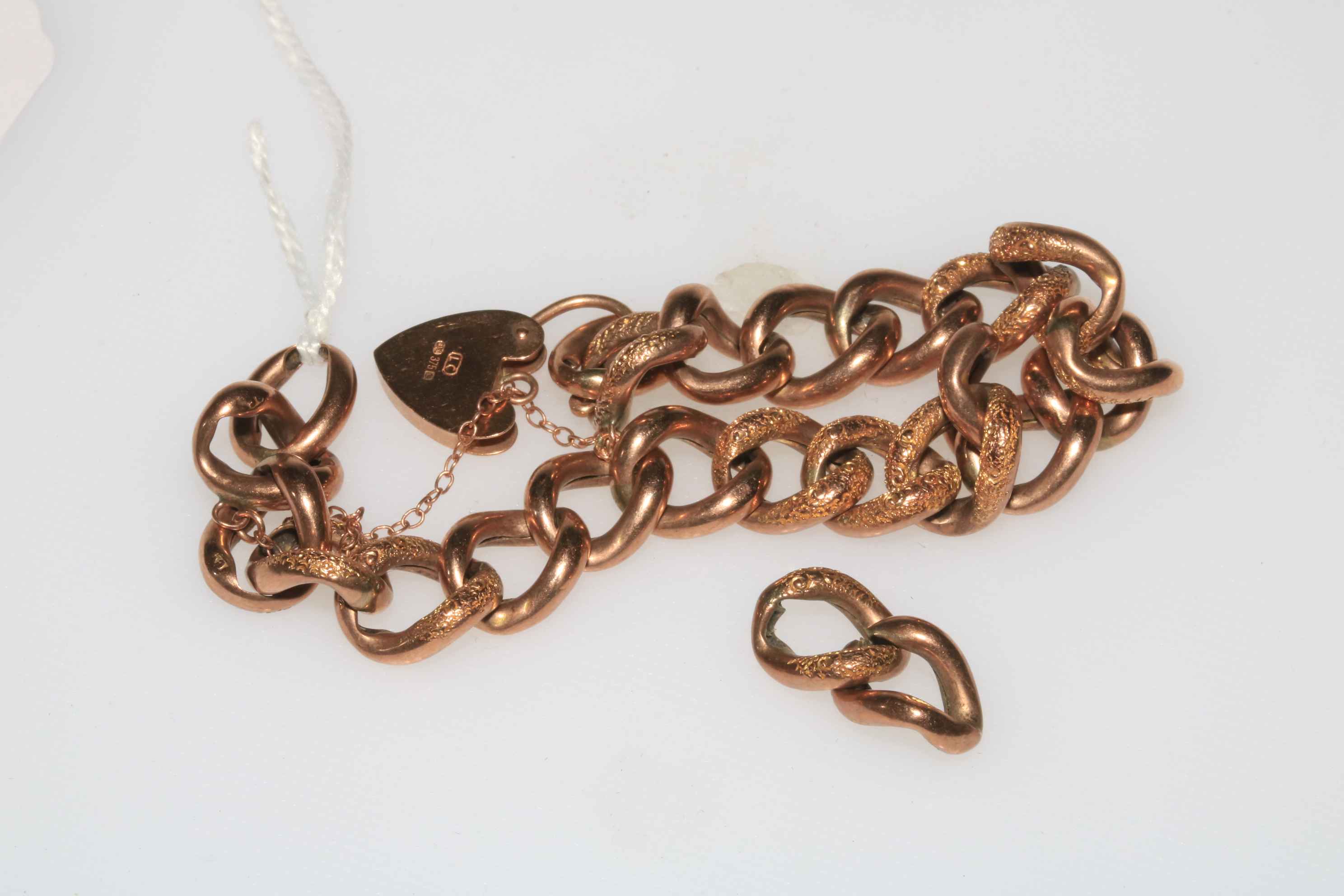9 carat gold chain link bracelet with padlock fastening.