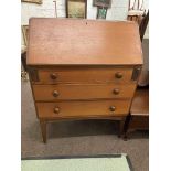 In the manner of John Herbert mid Century three drawer teak bureau, 102cm by 76cm by 43cm.