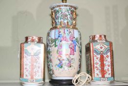 Oriental Chinese table lamp and a pair of vases.