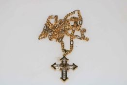 Two tone 18 carat gold and diamond cross and chain, the cross containing a total of ten diamonds.