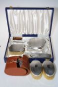Cased four piece engine turned silver backed brush and mirror set and pair of similar brushes,