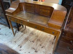 Reproduction satinwood and ebony line inlaid Carlton House desk, 101cm by 131cm by 59cm.