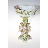 Large floral encrusted and cherub table centre piece, 41cm high.