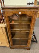 Slim walnut glazed panel cabinet and yew nest of three tables.