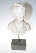 Bust of a young boy on stand, 53cm high.