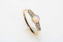 Opal and diamond ring set in 18 carat yellow gold, size Q.