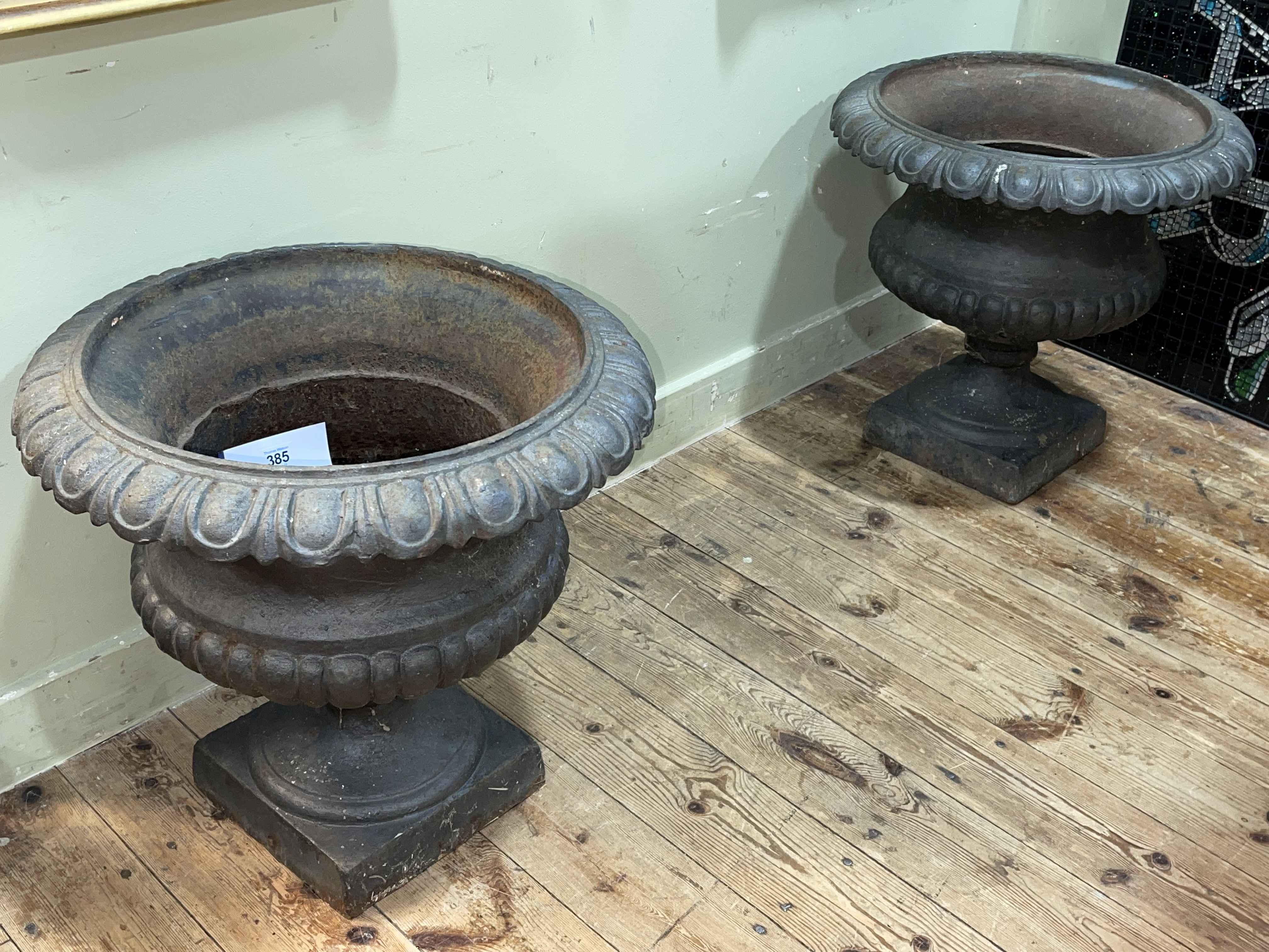 Pair cast iron pedestal garden urns, 45cm by 48cm diameter.