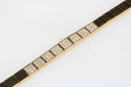 18 carat gold square link bracelet containing eight diamond links,