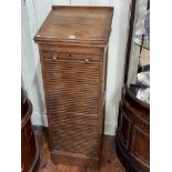 Early 20th Century oak easel topped tambour front filing cabinet, 108cm by 44.5cm by 40cm.